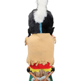 Toy figure of a person in a traditional outfit with a colorful background on a black background