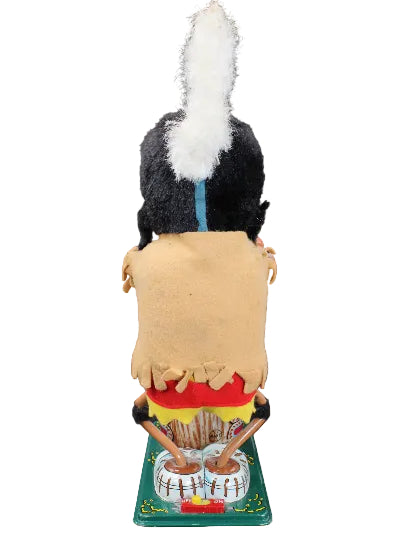 Toy figure of a person in a traditional outfit with a colorful background on a black background