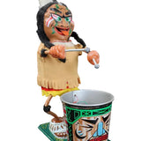 Colorful Native American figurine with a drum on a black background