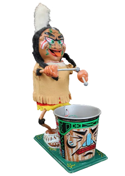 Colorful Native American figurine with a drum on a black background
