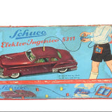 Vintage Schuco toy car packaging with a red car illustration on a blue background.