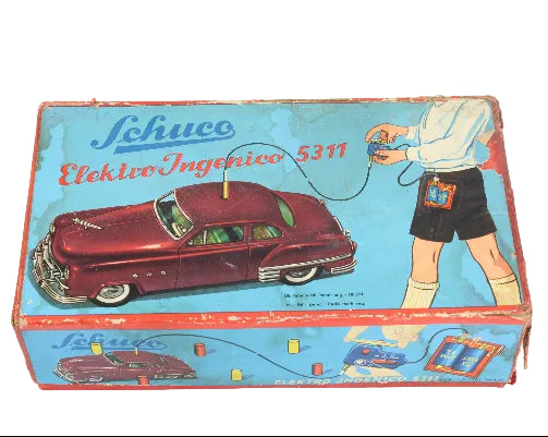 Vintage Schuco toy car packaging with a red car illustration on a blue background.