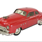 Model of a red classic car on a white background