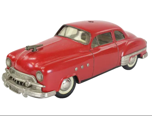 Model of a red classic car on a white background