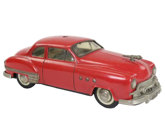 Model of a classic red car on a white background