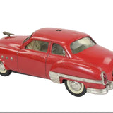 Red vintage toy car on a white background