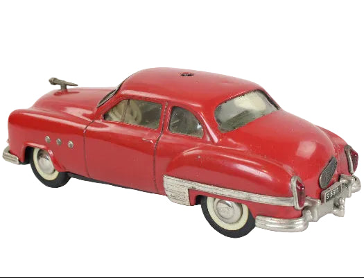 Red vintage toy car on a white background