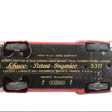 Bottom view of a Schuco toy car with branding and model number on a white background