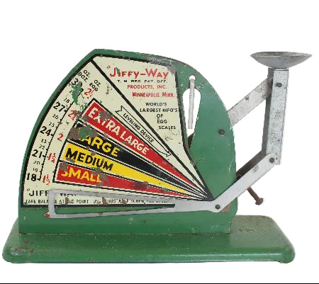 Vintage green scale with colorful label on a white background