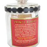 Glass jar with red label featuring text and black accents on a white background