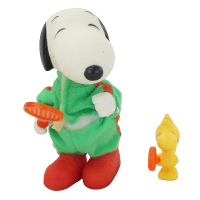 Snoopy in a green outfit with red shoes on a white background with Woodstock