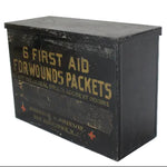 Vintage black metal first aid box with text on a white background
