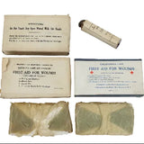 Vintage first aid kit components including boxes and bandages on a white background