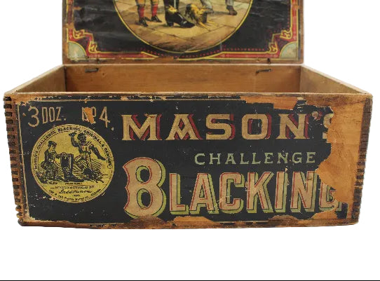 Vintage wooden box labeled 'Mason's Challenge Blacking' on a white background