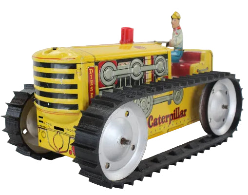 Toy Caterpillar tractor with a driver figure on a white background