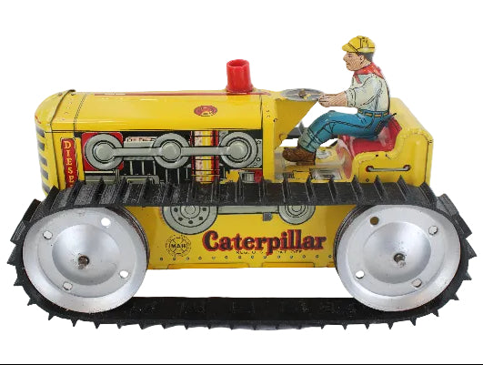 Vintage toy Caterpillar tractor with a driver figure on a white background