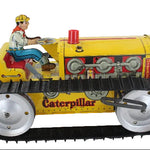 Vintage toy Caterpillar tractor with a driver figure on a white background
