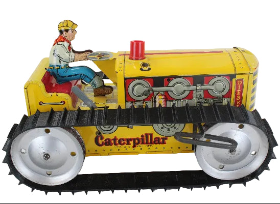 Vintage toy Caterpillar tractor with a driver figure on a white background