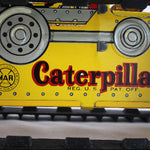 Close-up of a yellow Caterpillar product with visible Marx branding.