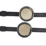 Two black wristbands with circular mesh centers on a white background