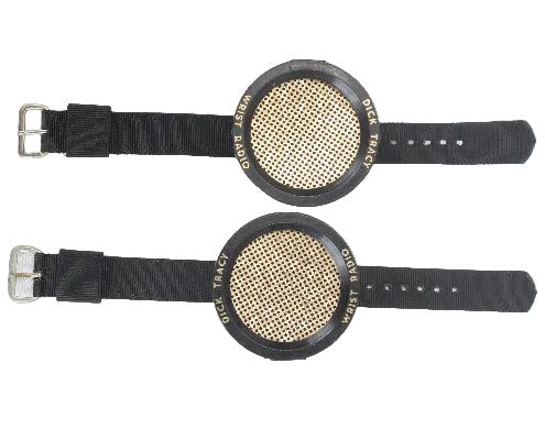 Two black wristbands with circular mesh centers on a white background