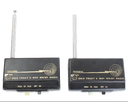 Two Dick Tracy 2-way wrist radios on a white background