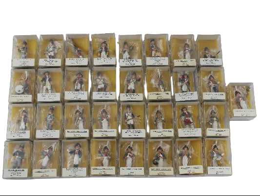 Collection of soldier lead figurines on a white background