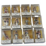 Collection of model figures in packaging on a white background