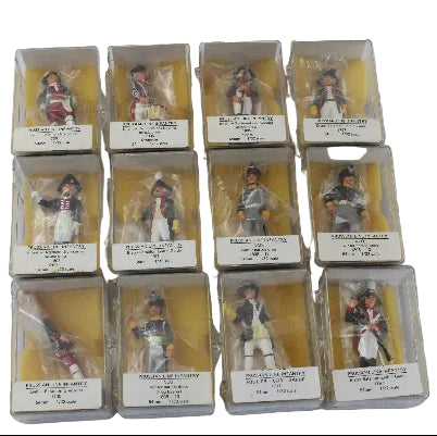 Collection of model figures in packaging on a white background