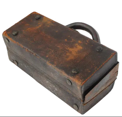 Vintage leather-bound box with metal clasp on a white background