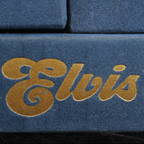 Close-up of 'Elvis' logo on a blue background