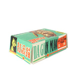 A vintage Chinese matchbox package for 'Da Gun Mao' matches, featuring a green and white design with red text and a cat illustration, set against a plain white background.