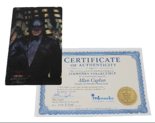 A Batman collectible card featuring Batman in a dark suit, displayed next to its blue and white Certificate of Authenticity from Allan Caplan for Inkworks Collectible.