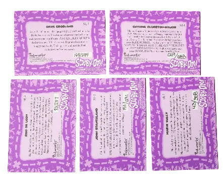 Five purple and white Scooby-Doo! trading cards autographed by the artist and arranged on a dark gray background, showing both front and back designs.