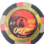 A circular 007 James Bond themed poker chip on a dark textured background. The chip features a black outer ring with pink and gray segments, a gold inner ring, and a red and black center graphic with the text 'JAMES BOND', '007', 'AP', 'LIMITED EDITION OF 3000', and 'inkworks'.