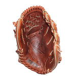 A brown leather baseball glove held up by a hand against a white fabric background. The glove features tan contrast stitching and embossed branding.